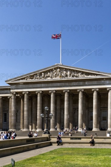 London, United Kingdom - 14 May 2025: Tourists gathering on the steps of the famous British Museum in London