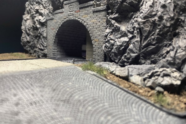 Modelling diorama: Detailed view of tunnel portal, rocks, road and tracks, Haan, North Rhine-Westphalia, Germany