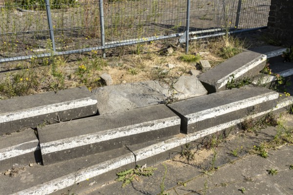 Concrete barricades with white stripes on pavement, Manheim, North Rhine-Westphalia, Germany