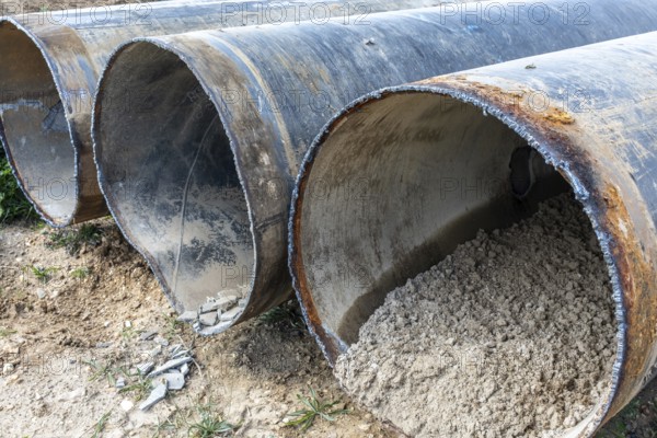 Cut open pipes with concrete residue, Manheim, North Rhine-Westphalia, Germany