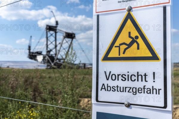 Warning sign Danger of falling in Hambach open-cast mine, Manheim, North Rhine-Westphalia, Germany