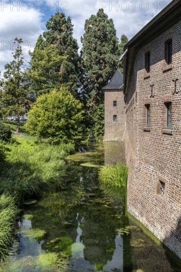 Brick façade of Paffendorf Castle with moat, Paffendorf, North Rhine-Westphalia, Germany