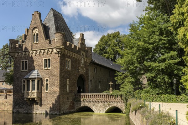Gatehouse with bridge over moat Paffendorf Castle, Paffendorf, North Rhine-Westphalia, Germany