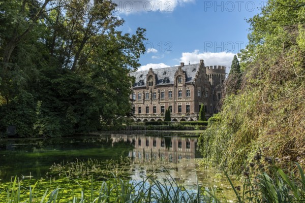 Castle on the water with reflection, Paffendorf, North Rhine-Westphalia, Germany
