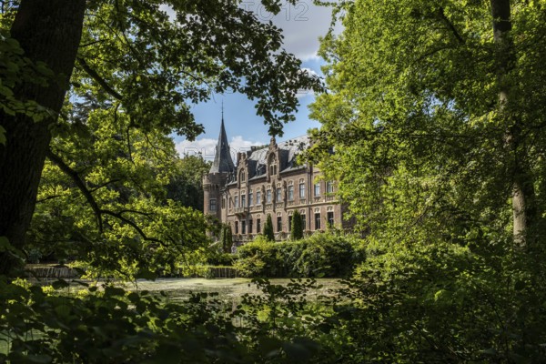 Castle framed by trees, Paffendorf, North Rhine-Westphalia, Germany