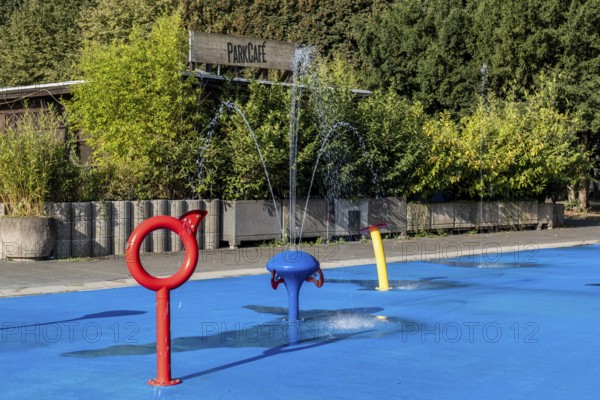 Water playground with red ring and fountain, Cologne green belt, North Rhine-Westphalia