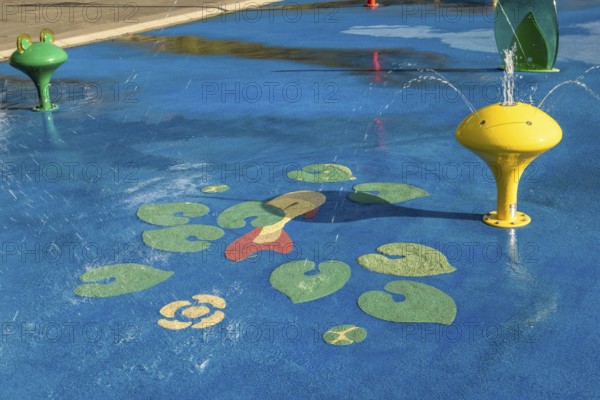 Yellow water play equipment with water lily motif