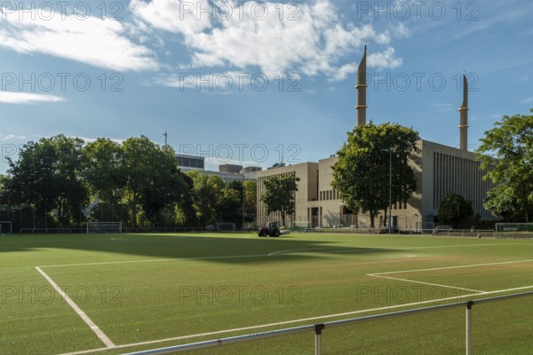 Football pitch with mosque in the background