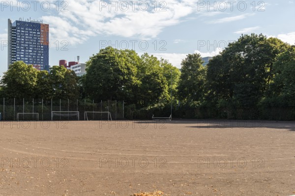 Football pitch with tower block in the background