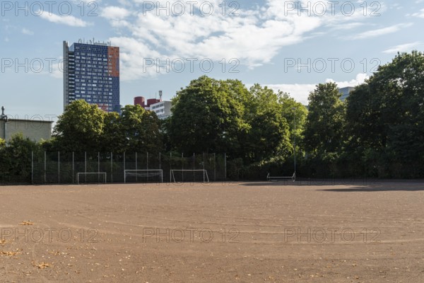 Football pitch with tower block in the background