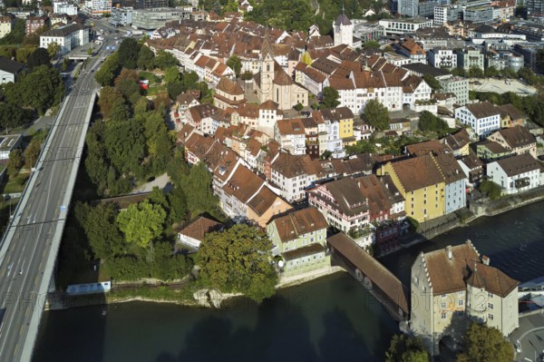 View of the old town with the parish church Maria Himmelfahrt, on the left the high bridge, in front the river Limmat and the covered wooden bridge with the Landvogteischloss, Baden, Canton, Aargau, Switzerland