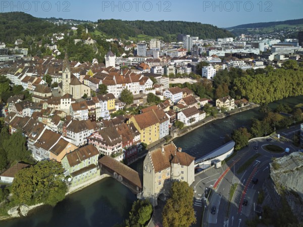 View of the old town with the parish church of Maria Himmelfahrt, in the background the ruins of Stein Castle, formerly an administrative centre of the Habsburgs, on the right the river Limmat and the covered wooden bridge with the Landvogteischloss, Baden, Canton, Aargau, Switzerland
