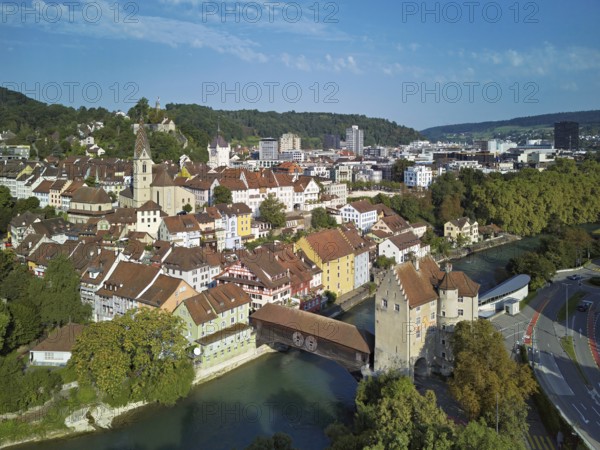 View of the old town with the parish church of Maria Himmelfahrt, in the background the ruins of Stein Castle, formerly an administrative centre of the Habsburgs, on the right the river Limmat and the covered wooden bridge with the Landvogteischloss, Baden, Canton, Aargau, Switzerland