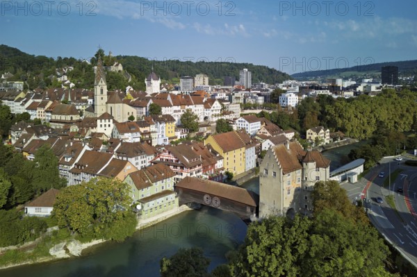 View of the old town with the parish church of Maria Himmelfahrt, in the background the ruins of Stein Castle, formerly an administrative centre of the Habsburgs, on the right the river Limmat and the covered wooden bridge with the Landvogteischloss, Baden, Canton, Aargau, Switzerland