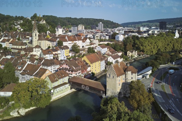 View of the old town with the parish church of Maria Himmelfahrt, in the background the ruins of Stein Castle, formerly an administrative centre of the Habsburgs, on the right the river Limmat and the covered wooden bridge with the Landvogteischloss, Baden, Canton, Aargau, Switzerland