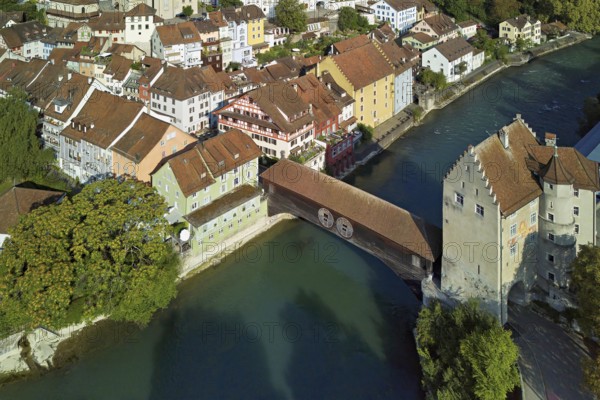 View of the old town, on the right the river Limmat and the covered wooden bridge with the Landvogteischloss, Baden, Canton, Aargau, Switzerland