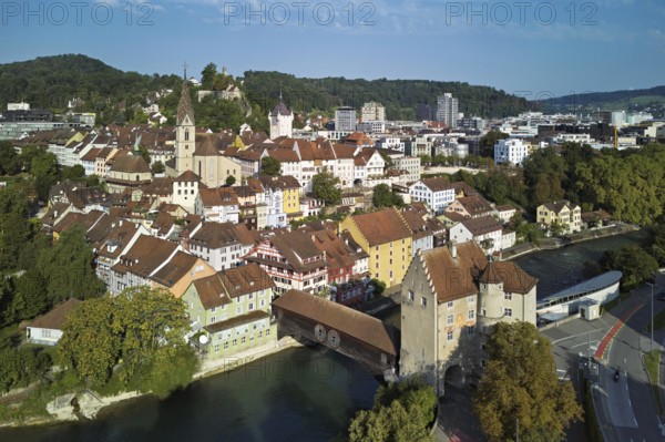 View of the old town with the parish church of Maria Himmelfahrt, in the background the ruins of Stein Castle, formerly an administrative centre of the Habsburgs, on the right the river Limmat and the covered wooden bridge with the Landvogteischloss, Baden, Canton, Aargau, Switzerland