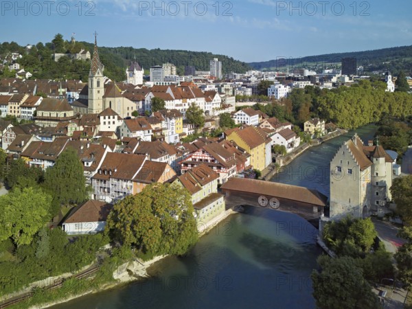 View of the old town with the parish church of Maria Himmelfahrt, in the background the ruins of Stein Castle, formerly an administrative centre of the Habsburgs, on the right the river Limmat and the covered wooden bridge with the Landvogteischloss, Baden, Canton Aargau, Switzerland