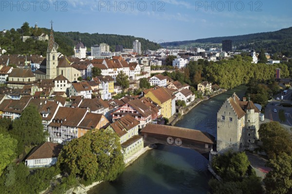 View of the old town with the parish church of Maria Himmelfahrt, in the background the ruins of Stein Castle, formerly an administrative centre of the Habsburgs, on the right the river Limmat and the covered wooden bridge with the Landvogteischloss, Baden, Canton, Aargau, Switzerland