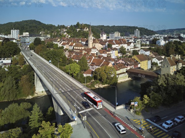 View of the old town with the parish church of Maria Himmelfahrt, in the foreground the high bridge, in the background the ruins of Stein Castle formerly an administrative centre of the Habsburgs, on the right the river Limmat and the covered wooden bridge with the Landvogteischloss, Baden, Canton, Aargau, Switzerland