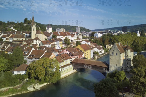 View of the old town with the parish church of Maria Himmelfahrt, in the background the ruins of Stein Castle, formerly an administrative centre of the Habsburgs, on the right the river Limmat and the covered wooden bridge with the Landvogteischloss, Baden, Canton, Aargau, Switzerland