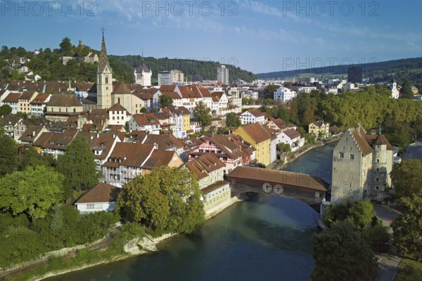 View of the old town with the parish church of Maria Himmelfahrt, in the background the ruins of Stein Castle, formerly an administrative centre of the Habsburgs, on the right the river Limmat and the covered wooden bridge with the Landvogteischloss, Baden, Canton, Aargau, Switzerland