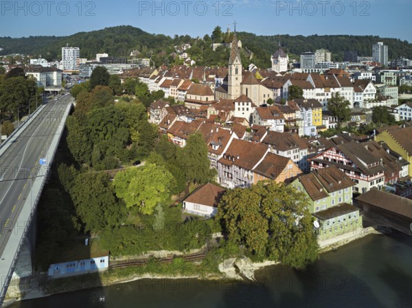 View of the old town with the parish church Maria Himmelfahrt, on the left the high bridge, behind the castle ruins Stein formerly an administrative centre of the Habsburgs, in front the river Limmat and the covered wooden bridge, Baden, Canton, Aargau, Switzerland