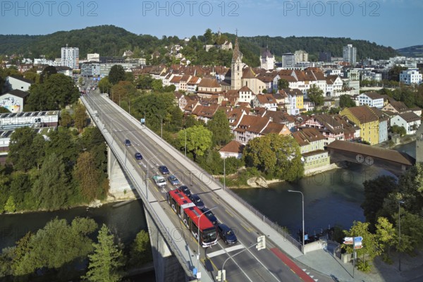 View of the old town with the parish church of Maria Himmelfahrt, in the foreground the high bridge, in the background the ruins of Stein Castle, formerly an administrative centre of the Habsburgs, on the right the river Limmat and the covered wooden bridge, Baden, Canton Aargau, Switzerland