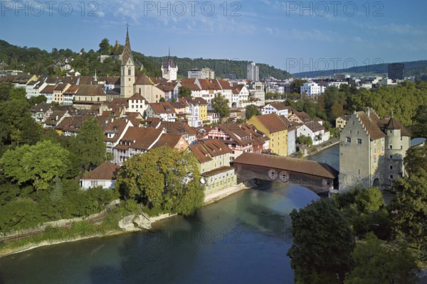 View of the old town with the parish church of Maria Himmelfahrt, in the background the ruins of Stein Castle, formerly an administrative centre of the Habsburgs, on the right the river Limmat and the covered wooden bridge with the Landvogteischloss, Baden, Canton, Aargau, Switzerland