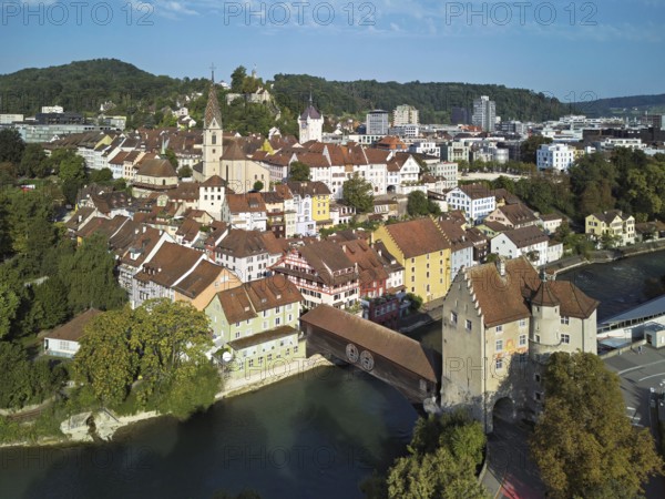 View of the old town with the parish church of Maria Himmelfahrt, in the background the ruins of Stein Castle, formerly an administrative centre of the Habsburgs, on the right the river Limmat and the covered wooden bridge with the Landvogteischloss, Baden, Canton, Aargau, Switzerland