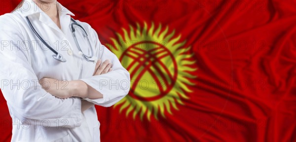 Doctor with crossed arms on Kyrgyzstan flag. Kyrgyzstan health and care concept. Female doctor on Kyrgyzstan flag
