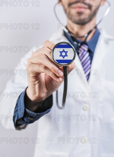 Israel healthcare system, doctor holding stethoscope. Israel health and medical insurance concept