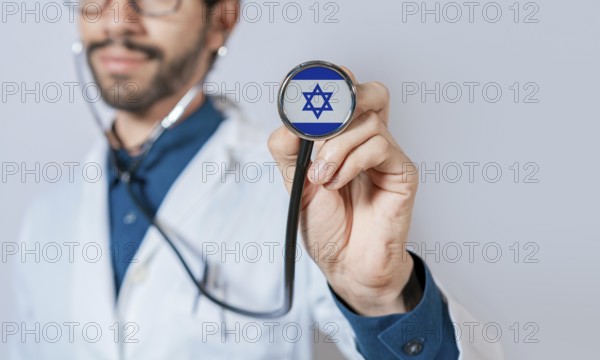 Doctor holding stethoscope with Israel flag. Israel health and care concept, Israel flag on stethoscope