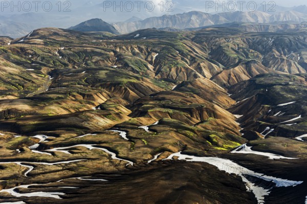 Mountain landscape, sunny, summer, snowfields, volcanic landscape, aerial view, Landmannalaugar, Fjallabak Nature Reserve, Icelandic Highlands, Iceland