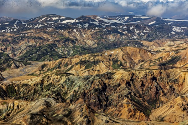 Mountain landscape, snowfields, sunny, summer, volcanic landscape, aerial view, Landmannalaugar, Fjallabak Nature Reserve, Icelandic Highlands, Iceland