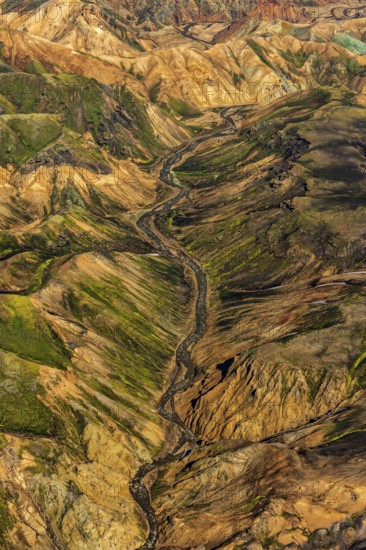 Mountain landscape, snowfields, river, valley, sunny, summer, volcanic landscape, aerial view, Landmannalaugar, Fjallabak Nature Reserve, Icelandic Highlands, Iceland