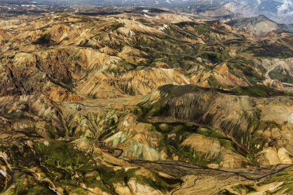Mountain landscape, snowfields, sunny, summer, volcanic landscape, aerial view, Landmannalaugar, Fjallabak Nature Reserve, Icelandic Highlands, Iceland