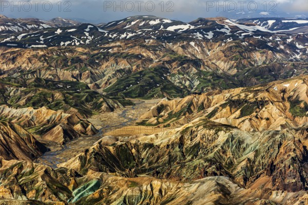 Mountain landscape, snowfields, sunny, summer, volcanic landscape, aerial view, ryolite rock (green), Landmannalaugar, Fjallabak Nature Reserve, Icelandic Highlands, Iceland