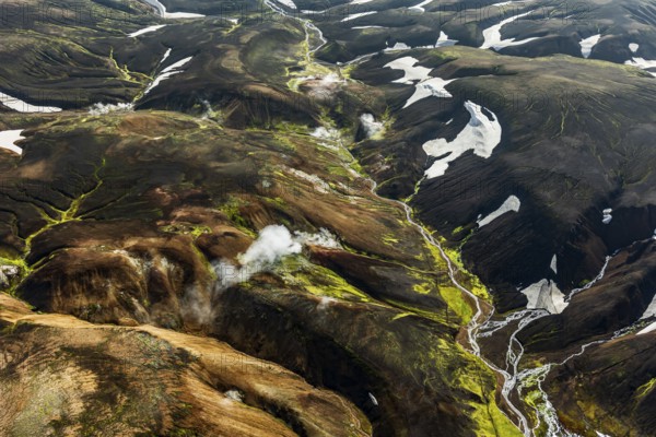 Mountain landscape, sunny, summer, hot springs, snowfields, volcanic landscape, aerial view, Landmannalaugar, Fjallabak Nature Reserve, Icelandic Highlands, Iceland