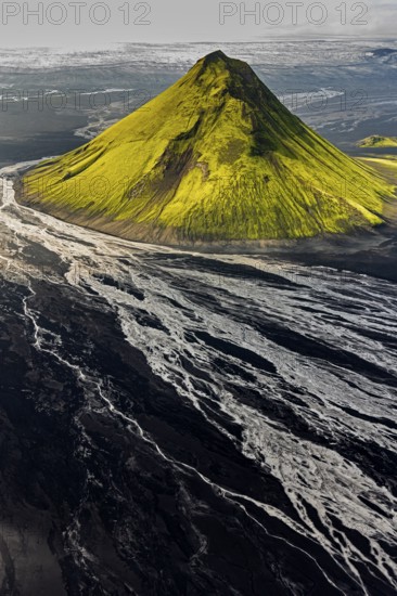 Mountain landscape, sunny, summer, volcanic landscape, river bed, river, aerial view, backlight, Maelifell volcano, Maelifellssandur, behind it Myrdalsjökull glacier, Icelandic Highlands, Iceland