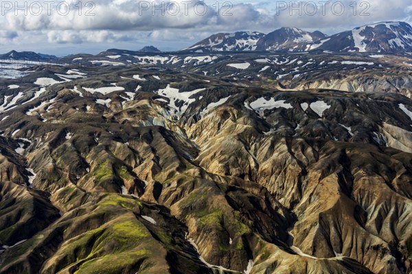 Mountain landscape, sunny, summer, snowfields, volcanic landscape, aerial view, Landmannalaugar, Fjallabak Nature Reserve, Icelandic Highlands, Iceland