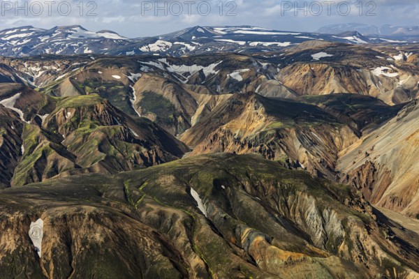 Mountain landscape, sunny, summer, snowfields, volcanic landscape, aerial view, Landmannalaugar, Fjallabak Nature Reserve, Icelandic Highlands, Iceland