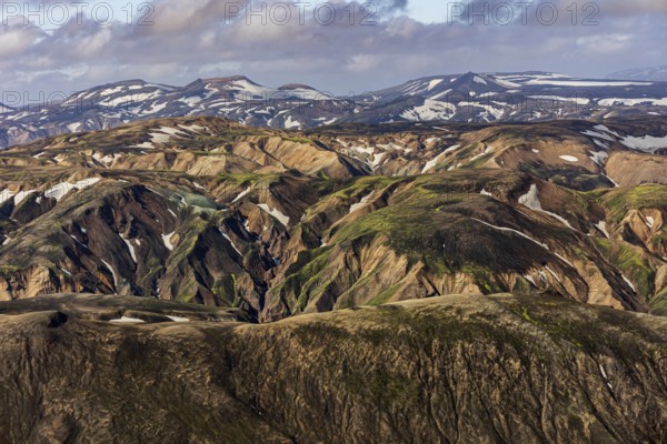 Mountain landscape, sunny, summer, snowfields, volcanic landscape, aerial view, Landmannalaugar, Fjallabak Nature Reserve, Icelandic Highlands, Iceland