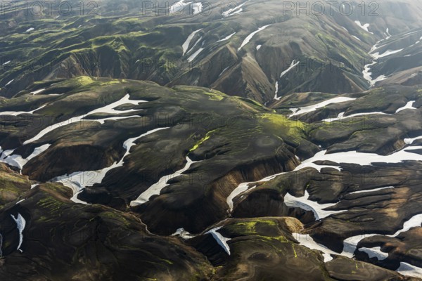 Mountain landscape, sunny, summer, snowfields, volcanic landscape, aerial view, Landmannalaugar, Fjallabak Nature Reserve, Icelandic Highlands, Iceland