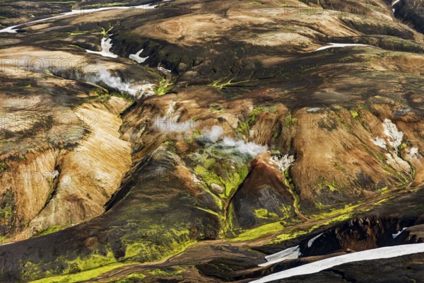 Mountain landscape, sunny, summer, snowfields, hot springs, volcanic landscape, aerial view, Landmannalaugar, Fjallabak Nature Reserve, Icelandic Highlands, Iceland