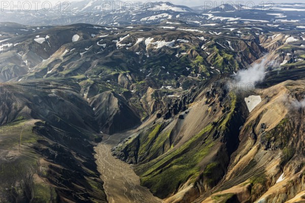 Mountain landscape, sunny, summer, river, snowfields, volcanic landscape, aerial view, Landmannalaugar, Fjallabak Nature Reserve, Icelandic Highlands, Iceland