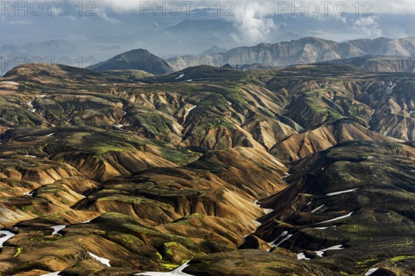 Mountain landscape, sunny, summer, snowfields, volcanic landscape, aerial view, Landmannalaugar, Fjallabak Nature Reserve, Icelandic Highlands, Iceland