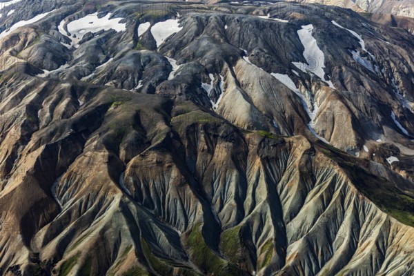 Mountain landscape, sunny, summer, snowfields, volcanic landscape, aerial view, Landmannalaugar, Fjallabak Nature Reserve, Icelandic Highlands, Iceland