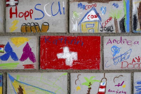 Brick wall painted by schoolchildren, Interlaken, Switzerland