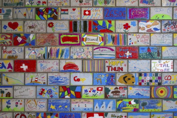 Brick wall painted by schoolchildren, Interlaken, Switzerland